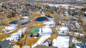 Snowy aerial view with a residential view