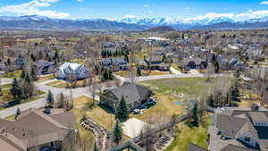 Birds eye view of property featuring a mountain view and a residential view