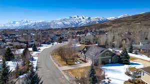 Drone / aerial view featuring a mountain view and a residential view