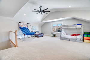 Bedroom with carpet flooring, recessed lighting, baseboards, and lofted ceiling