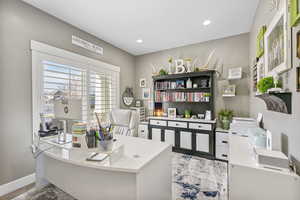 Home office featuring recessed lighting and baseboards