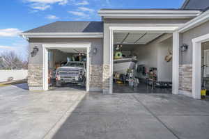 Garage featuring concrete driveway