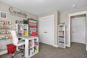 Game room with baseboards and carpet floors