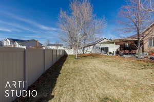 View of yard with a patio and a fenced backyard