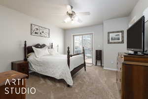 Bedroom featuring a ceiling fan, access to outside, light colored carpet, and baseboards