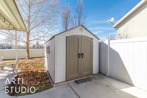 View of shed featuring a fenced backyard