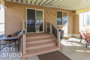 Property entrance with stucco siding