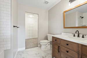 Full bath featuring visible vents, toilet, marble finish floor, baseboards, and vanity