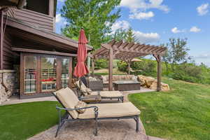 View of patio featuring a pergola and an outdoor living space