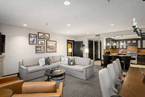 Living room with visible vents and recessed lighting