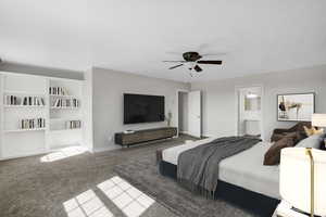 Bedroom featuring ensuite bathroom, baseboards, carpet floors, and ceiling fan