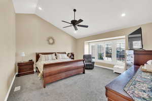 Carpeted bedroom with visible vents, recessed lighting, baseboards, and vaulted ceiling