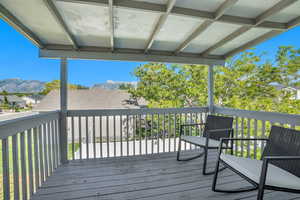 Wooden deck featuring a mountain view
