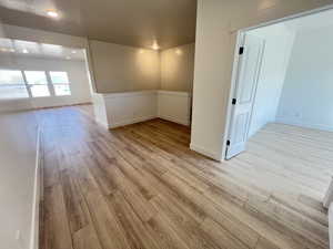 Spare room with recessed lighting, baseboards, and light wood finished floors