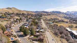 Birds eye view of property featuring a mountain view and a residential view