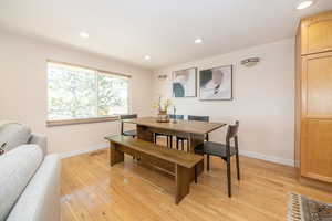 Dining room featuring visible vents, recessed lighting, baseboards, and light wood-type flooring