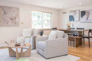 Living area with recessed lighting, baseboards, and light wood finished floors