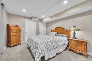 Bedroom featuring recessed lighting, baseboards, and light colored carpet