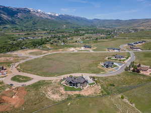 Aerial overview of property's location featuring a mountain backdrop