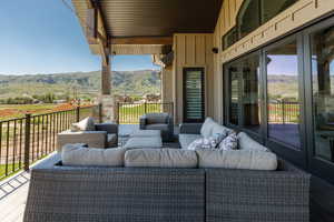 View of patio with a mountain view and outdoor lounge area