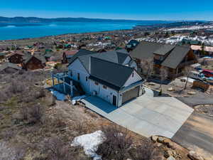 Bird's eye view with a water and mountain view and a residential view
