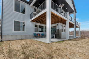 Rear view of property featuring a patio