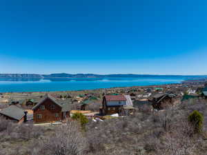 Water view featuring a residential view and a mountain view