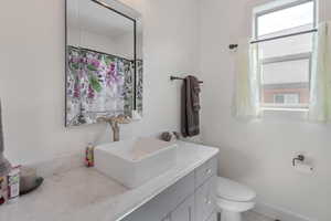 Bathroom with toilet and vanity
