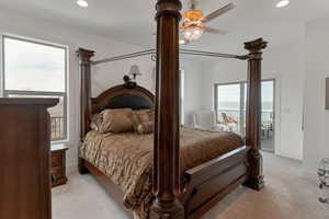 Bedroom with recessed lighting, access to exterior, light colored carpet, and baseboards