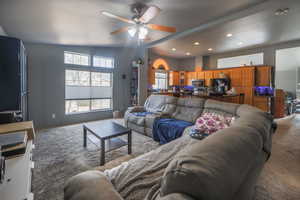 Living room featuring recessed lighting, carpet, and ceiling fan