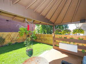 View of patio with fence