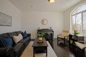 Living room featuring plenty of natural light and hardwood floors