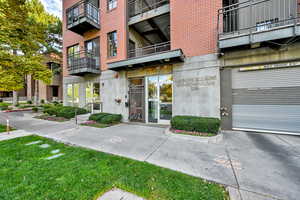 Entrance to property featuring brick siding