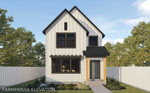 Modern inspired farmhouse featuring fence, board and batten siding, and a shingled roof