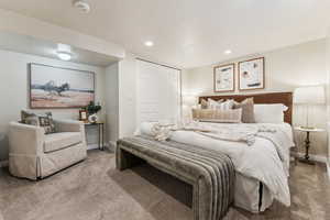 Carpeted bedroom featuring a closet, recessed lighting, and baseboards