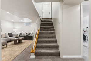 Stairs featuring recessed lighting, washer / dryer, baseboards, and carpet