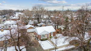 Snowy aerial view featuring a residential view