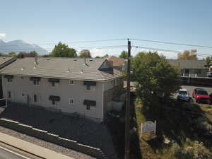 Exterior space with central air condition unit and a tile roof