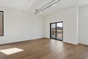 Unfurnished room with recessed lighting, baseboards, and wood finished floors