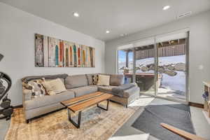 Living room with recessed lighting, visible vents, and baseboards