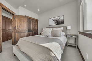 Bedroom featuring recessed lighting, baseboards, and carpet flooring
