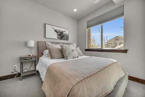 Bedroom with carpet and baseboards