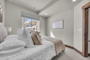 Bedroom featuring recessed lighting, visible vents, carpet flooring, and baseboards