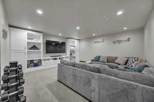 Living room with recessed lighting and light carpet