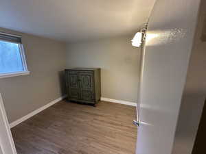 Spare room with wood finished floors and baseboards