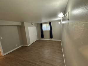 Spare room with wood finished floors and baseboards