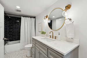 Second full bathroom with beautiful tile and vanity selections.