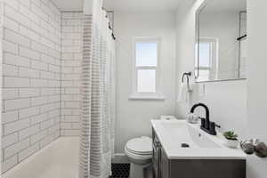 Full main level bathroom with subway tile.