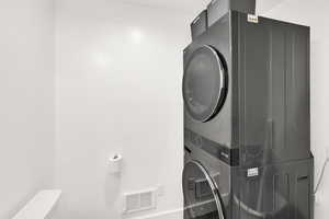 Laundry room with stacked washer / dryer in Apartment