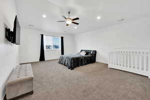 Carpeted bedroom with a ceiling fan, recessed lighting, visible vents, and baseboards